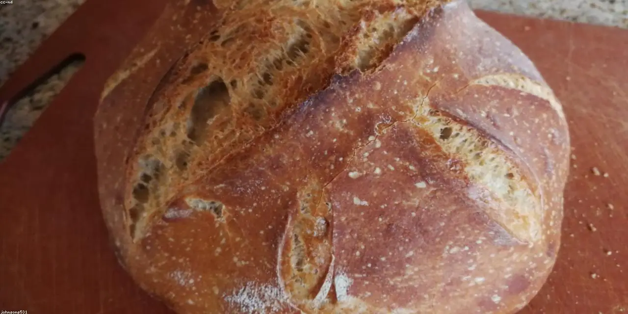 Hands shaping dough in the bakery